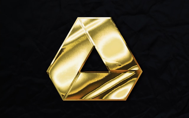 The Google Drive logo in gold against a black background.