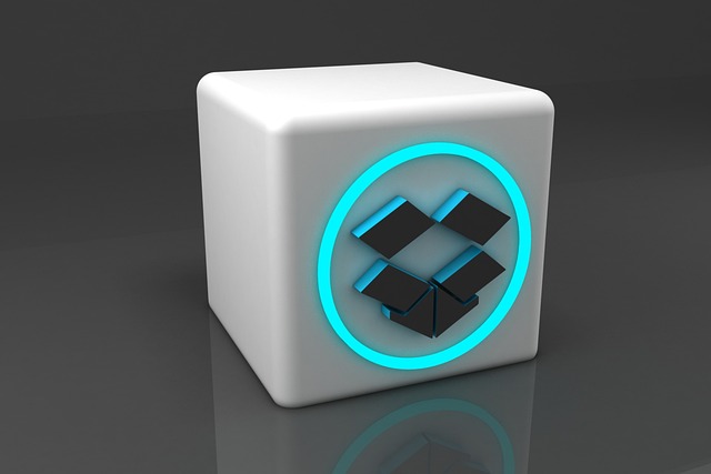 A 3D white cube with a glowing blue circular outline surrounding the Dropbox logo. 