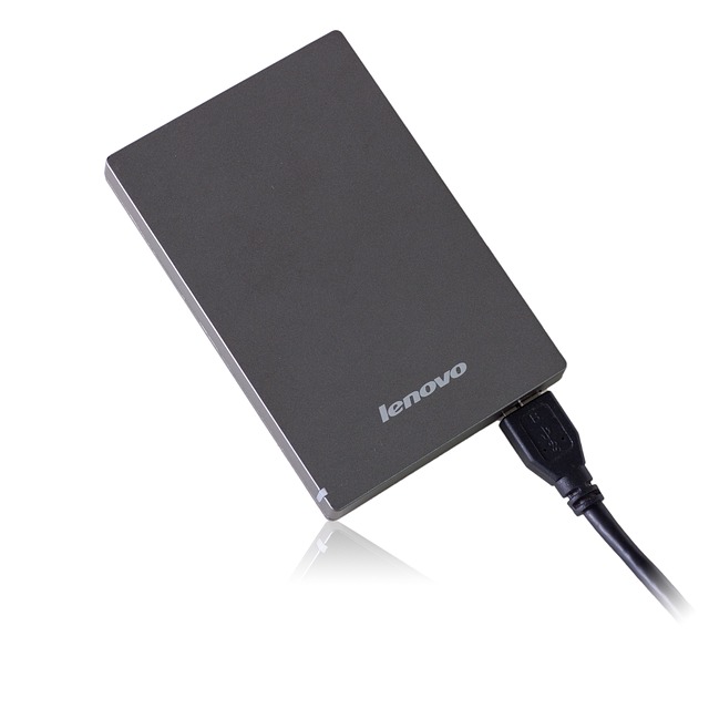 A gray Lenovo 1 TB portable hard drive.