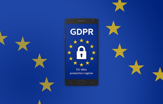 A GDPR lock icon on a smartphone screen surrounded by EU stars on a blue background.