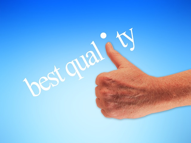 A hand giving a thumbs-up next to the words "best quality," symbolizing approval or high standards.